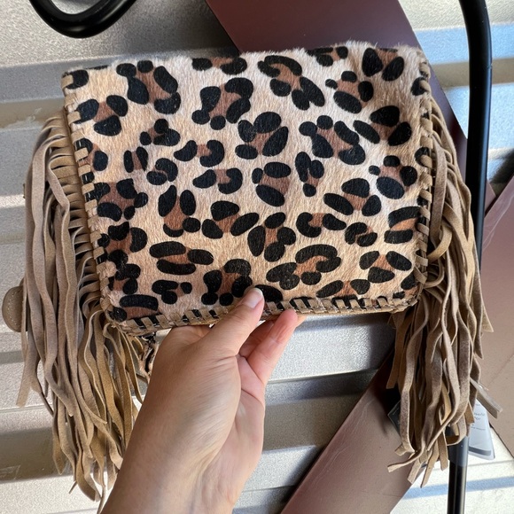 naughty monkey Handbags - SOLD!! Naughty Monkey Animal Hide Hair Fringe Crossbody Bag